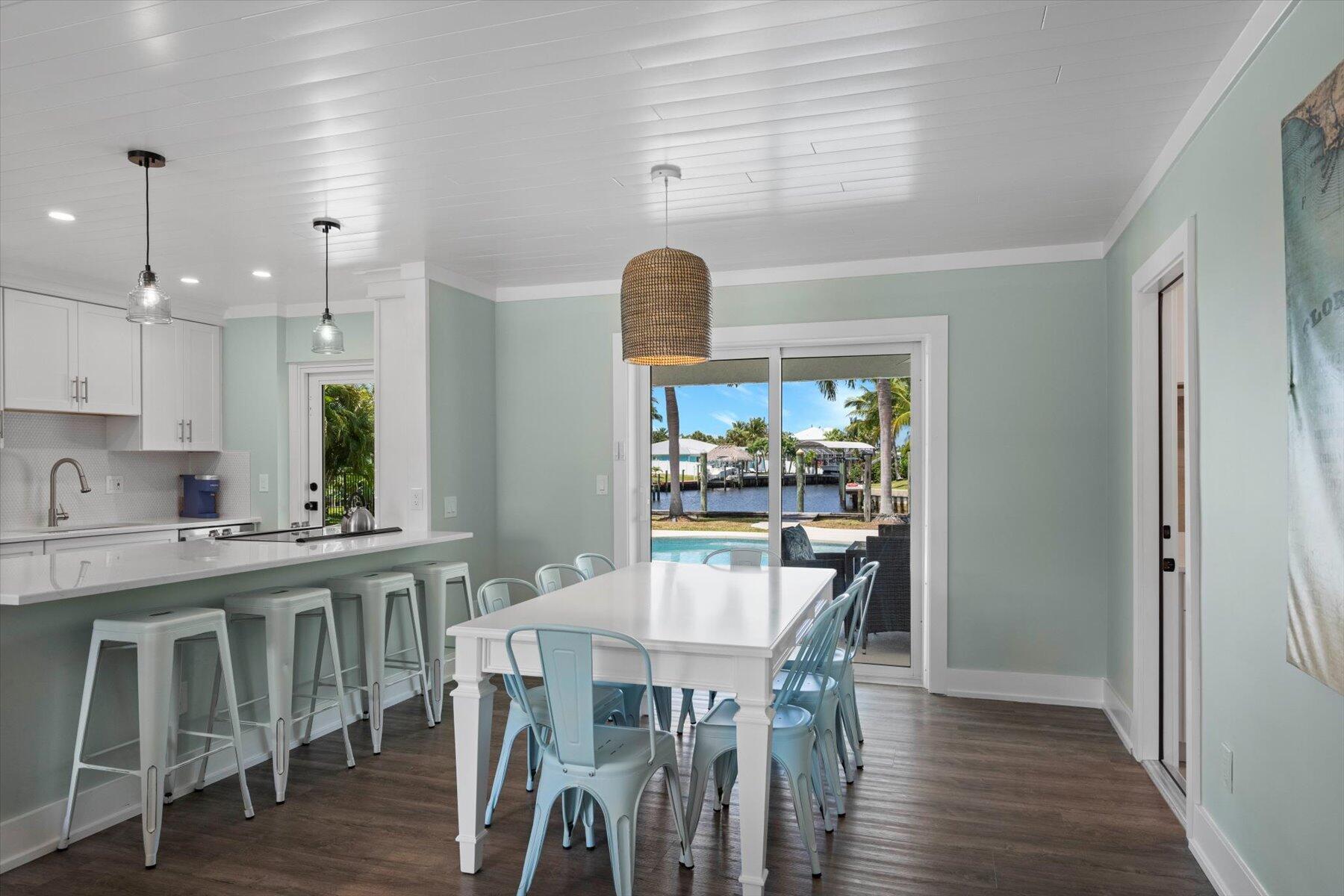 1389 Southwest Dyer Point Road Palm City, FL 34990 - Photo 17 of 55 a view of a dining room with furniture window and wooden floor