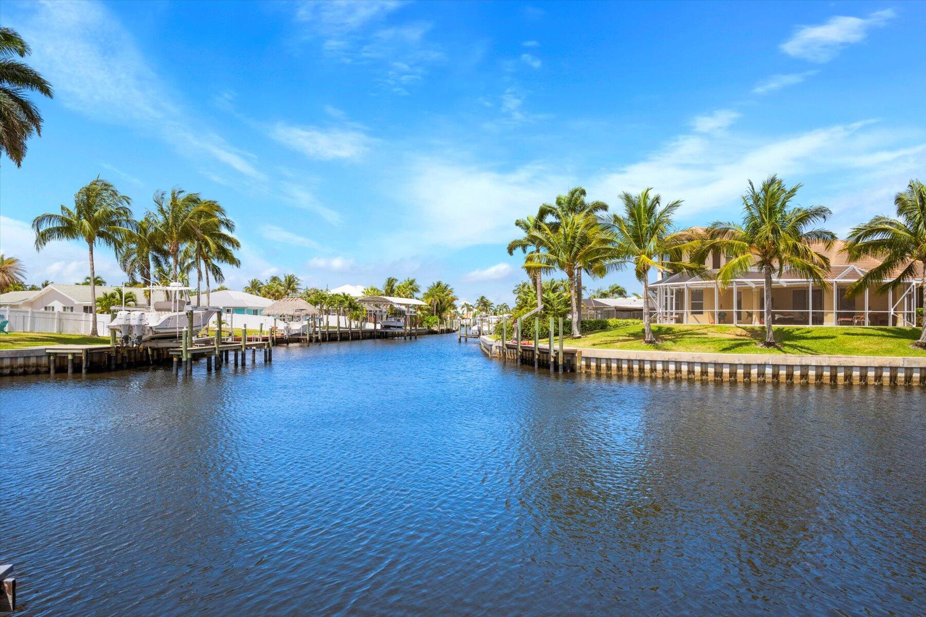 1389 Southwest Dyer Point Road Palm City, FL 34990 - Photo 35 of 55 a view of a ocean with boats and palm trees
