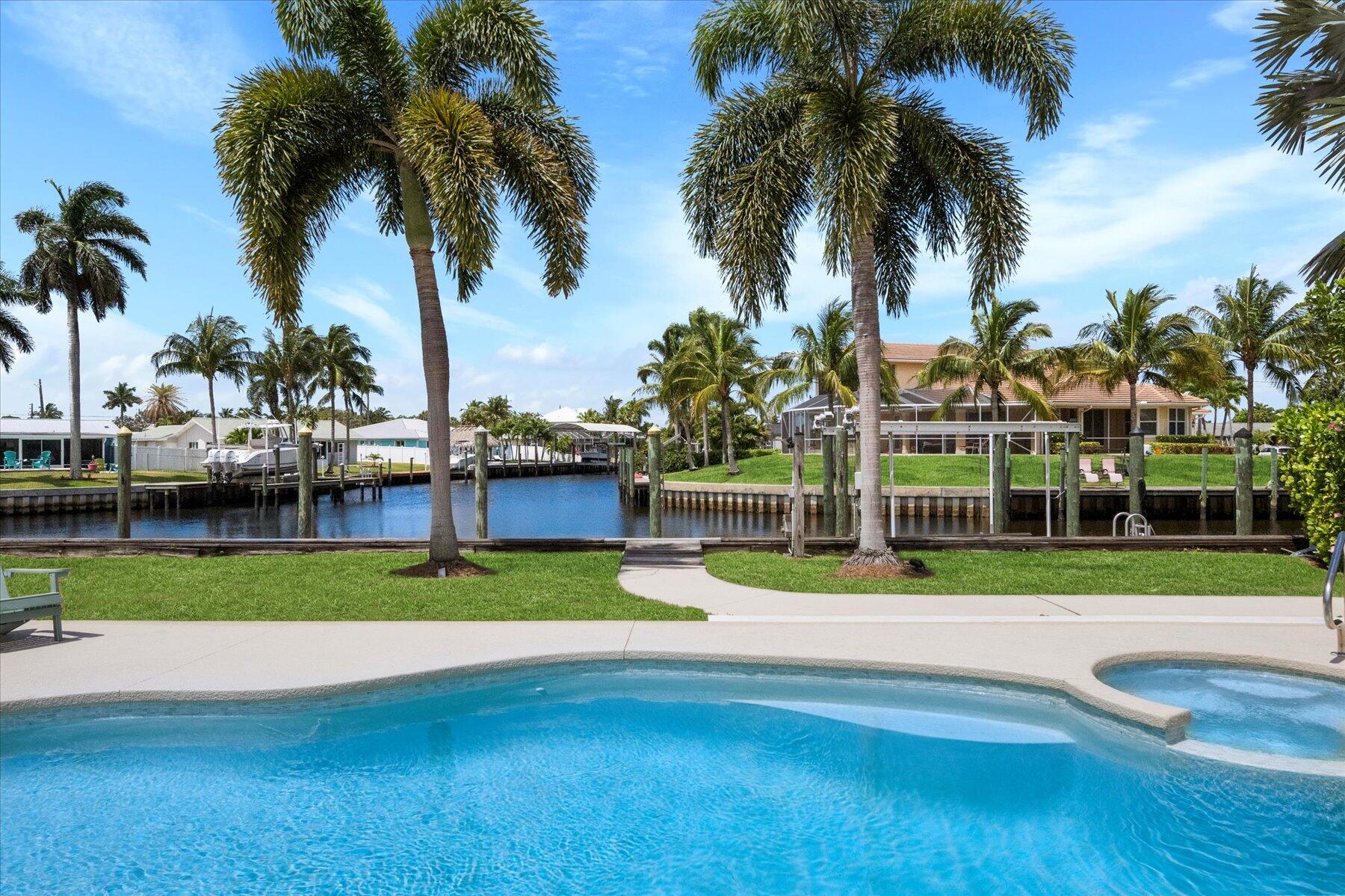 1389 Southwest Dyer Point Road Palm City, FL 34990 - Photo 36 of 55 a view of a yard and palm trees