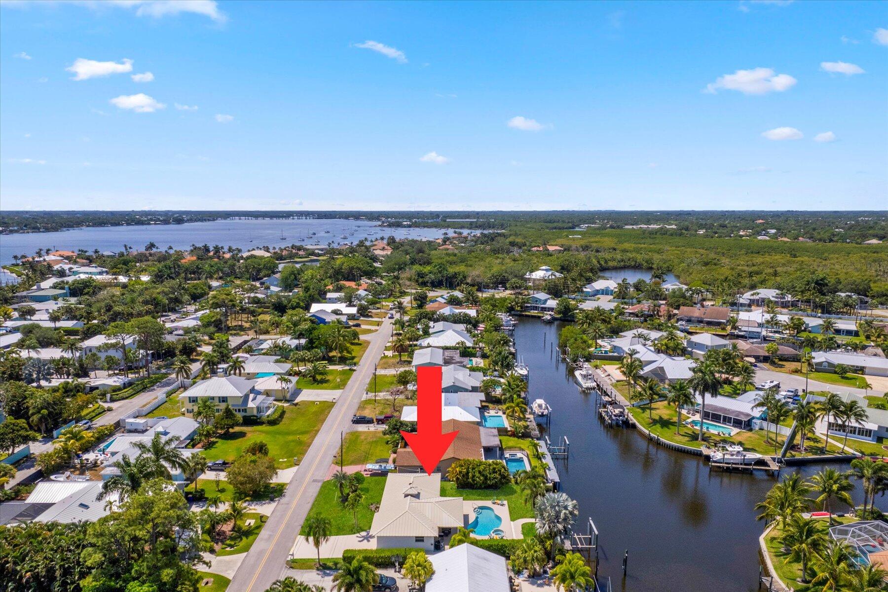 1389 Southwest Dyer Point Road Palm City, FL 34990 - Photo 53 of 55 an aerial view of residential houses with outdoor space