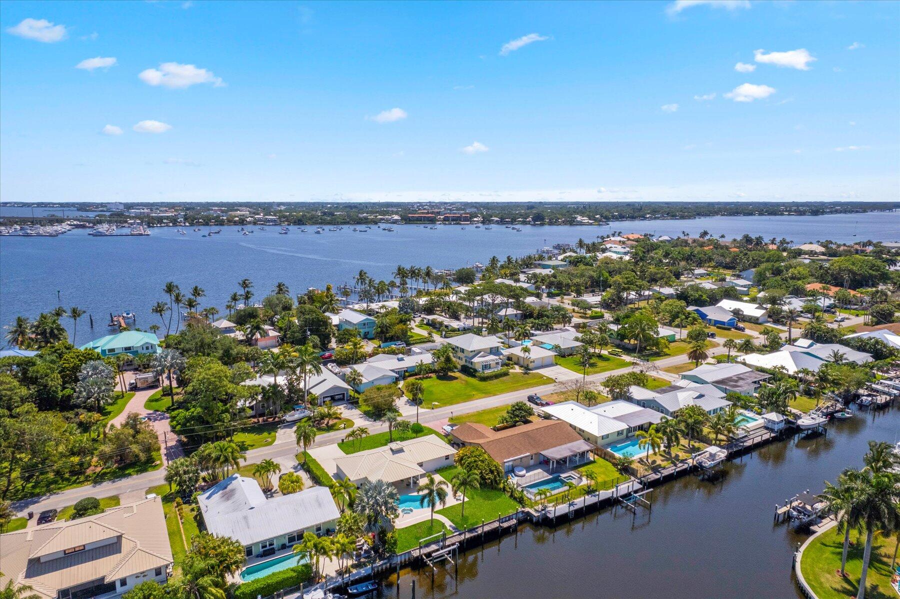 1389 Southwest Dyer Point Road Palm City, FL 34990 - Photo 54 of 55 an aerial view of residential houses with outdoor space and lake view