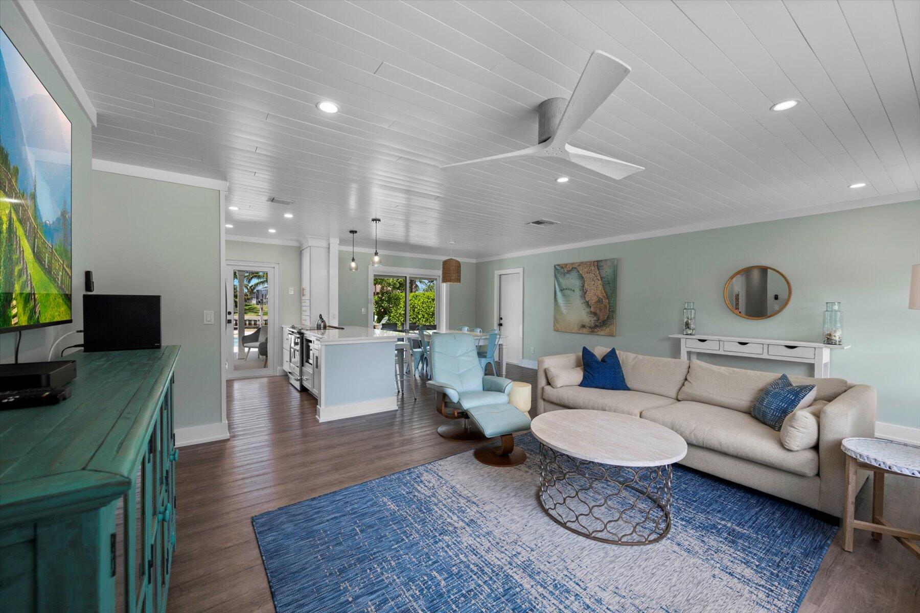 1389 Southwest Dyer Point Road Palm City, FL 34990 - Photo 6 of 55 a living room with furniture and a flat screen tv