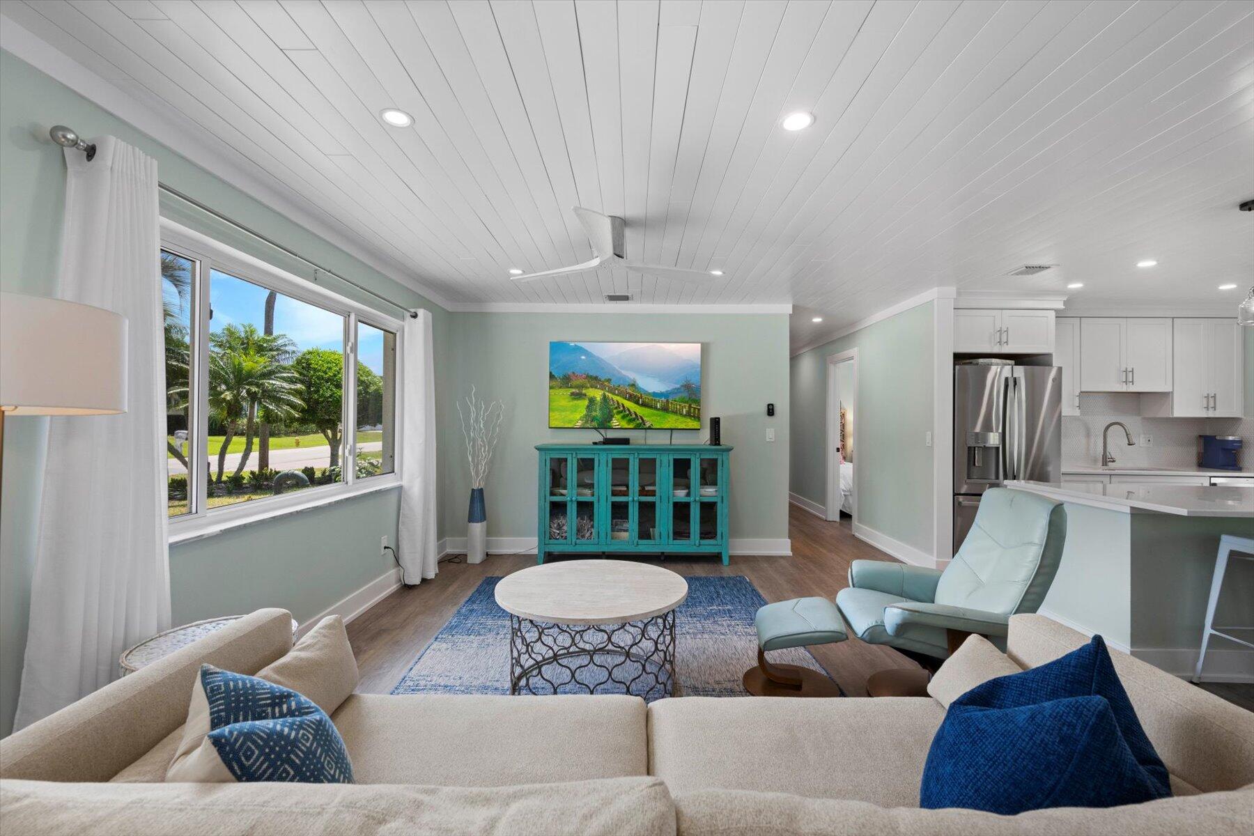 1389 Southwest Dyer Point Road Palm City, FL 34990 - Photo 10 of 55 a living room with furniture and a large window