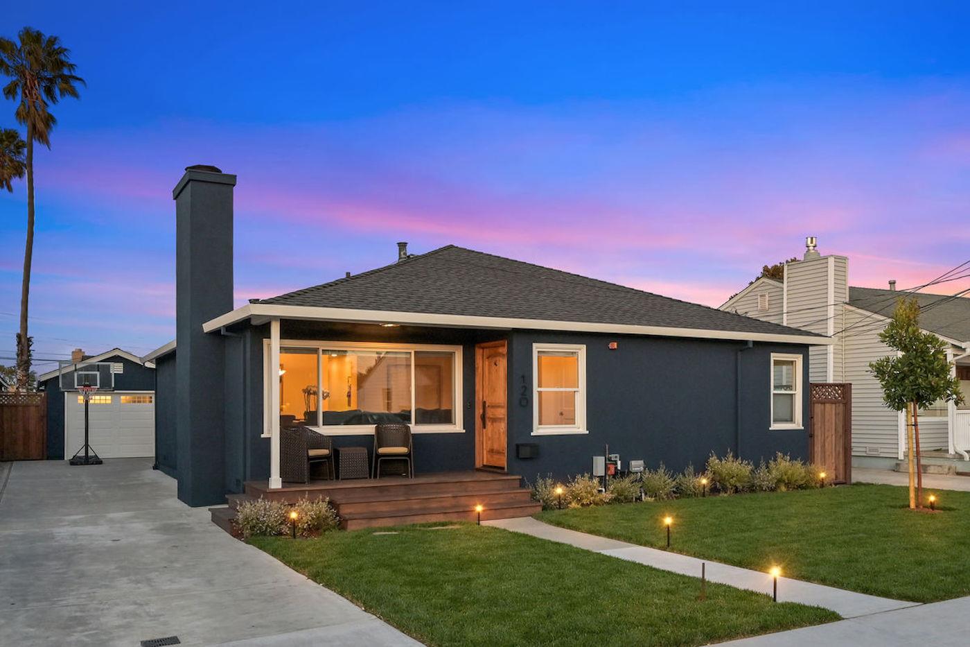 a front view of a house with garden