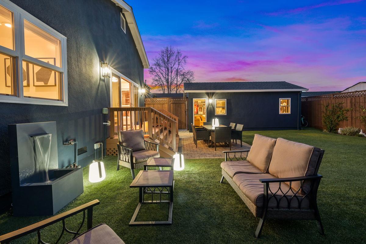 120 Ottawa Street San Mateo, CA 94401 - Photo 19 of 20 a view of a patio with couches table and chairs with wooden fence and plants