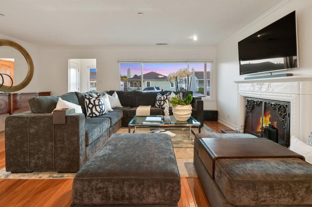 120 Ottawa Street San Mateo, CA 94401 - Photo 2 of 20 a living room with furniture a fireplace and a flat screen tv