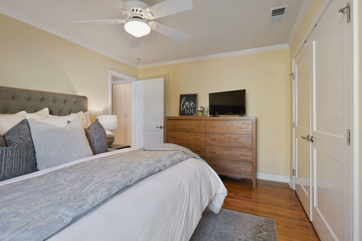 120 Ottawa Street San Mateo, CA 94401 - Photo 10 of 20 a bedroom with a bed and a flat tv screen on dresser