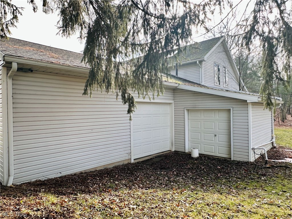 5175 Shields Road Canfield, OH 44406 - Photo 40 of 45 View of side of property featuring a garage