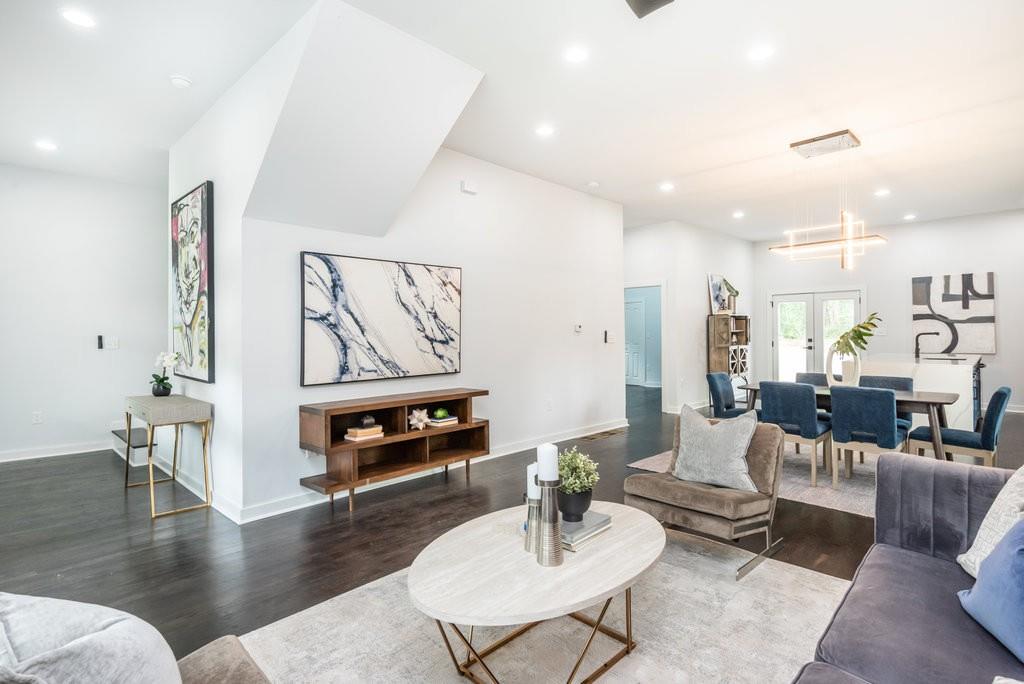 260 Wellington Street Southwest Atlanta, GA 30314 - Photo 1 of 1 a living room with furniture and wooden floor
