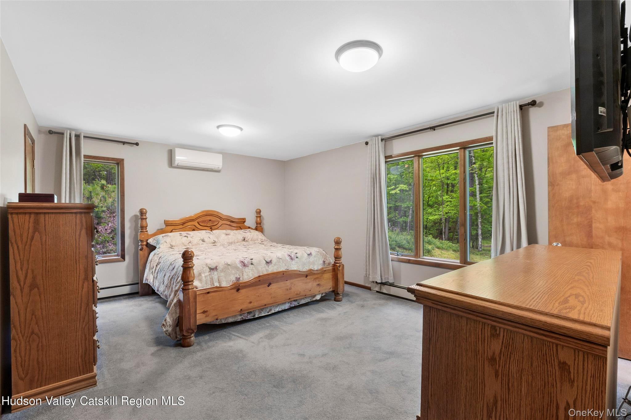 48 Deer Park Road Cairo, NY 12473 - Photo 16 of 33 a bedroom with a bed and a large window