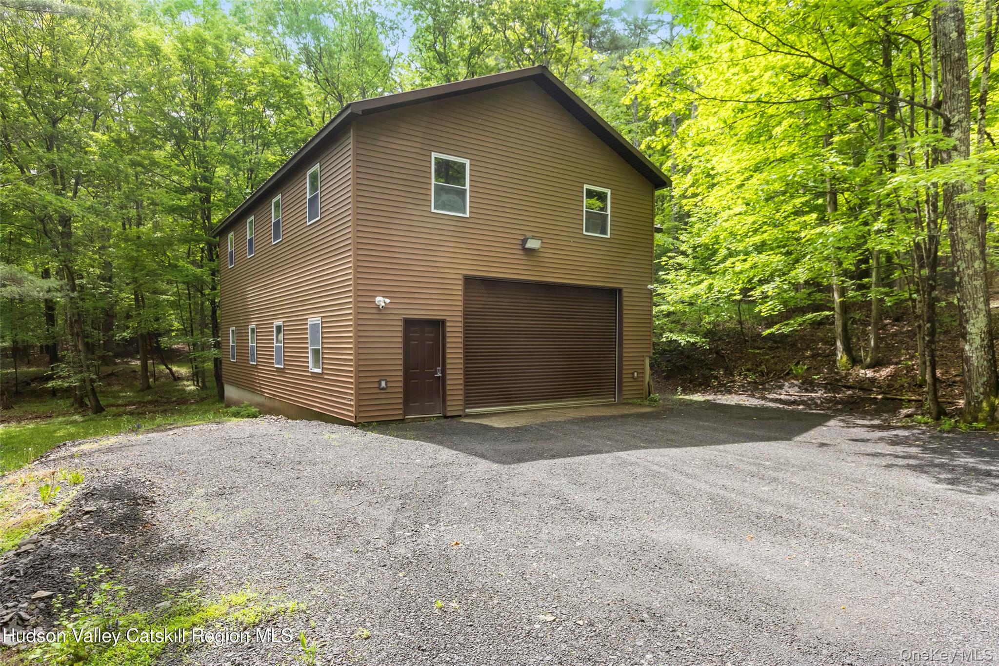 48 Deer Park Road Cairo, NY 12473 - Photo 24 of 33 a view of a house with backyard and trees