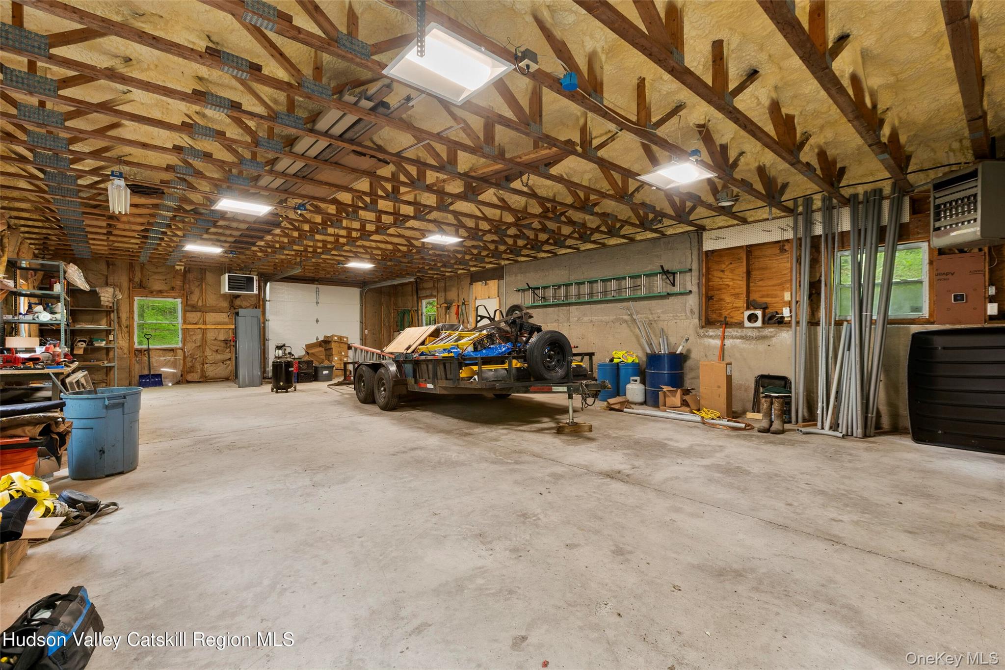 48 Deer Park Road Cairo, NY 12473 - Photo 25 of 33 a view of a garage with parked cars