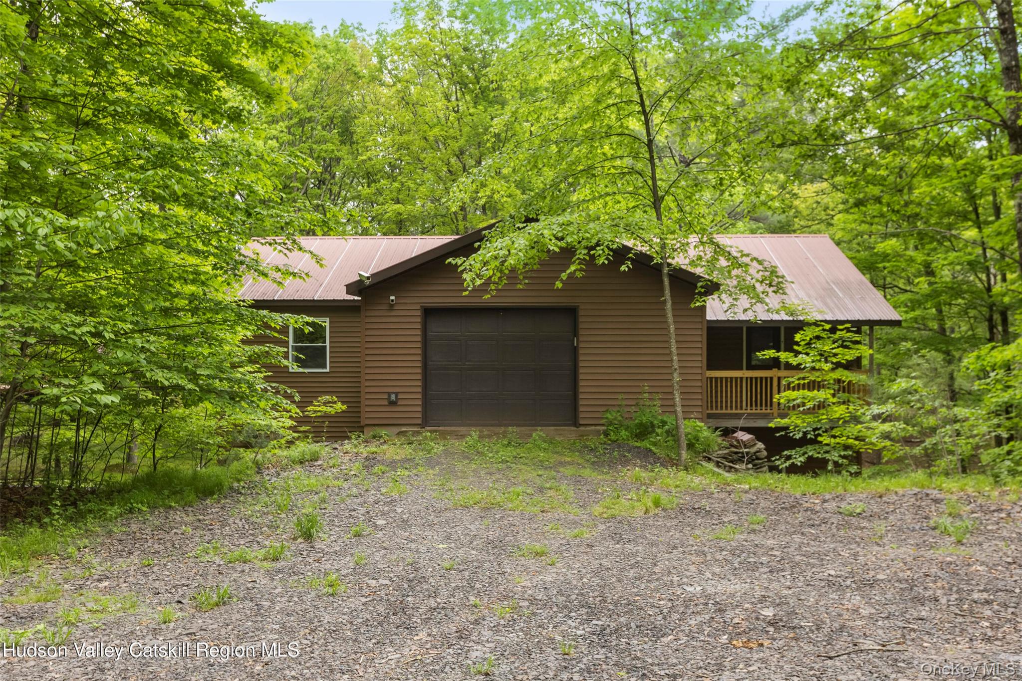 48 Deer Park Road Cairo, NY 12473 - Photo 26 of 33 a backyard of a house with plants and large tree