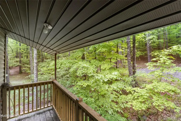 an aerial view of a house with garden space and street view
