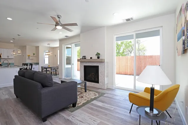 a living room with furniture and a fireplace