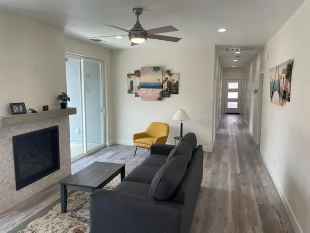 a living room with furniture and a fireplace