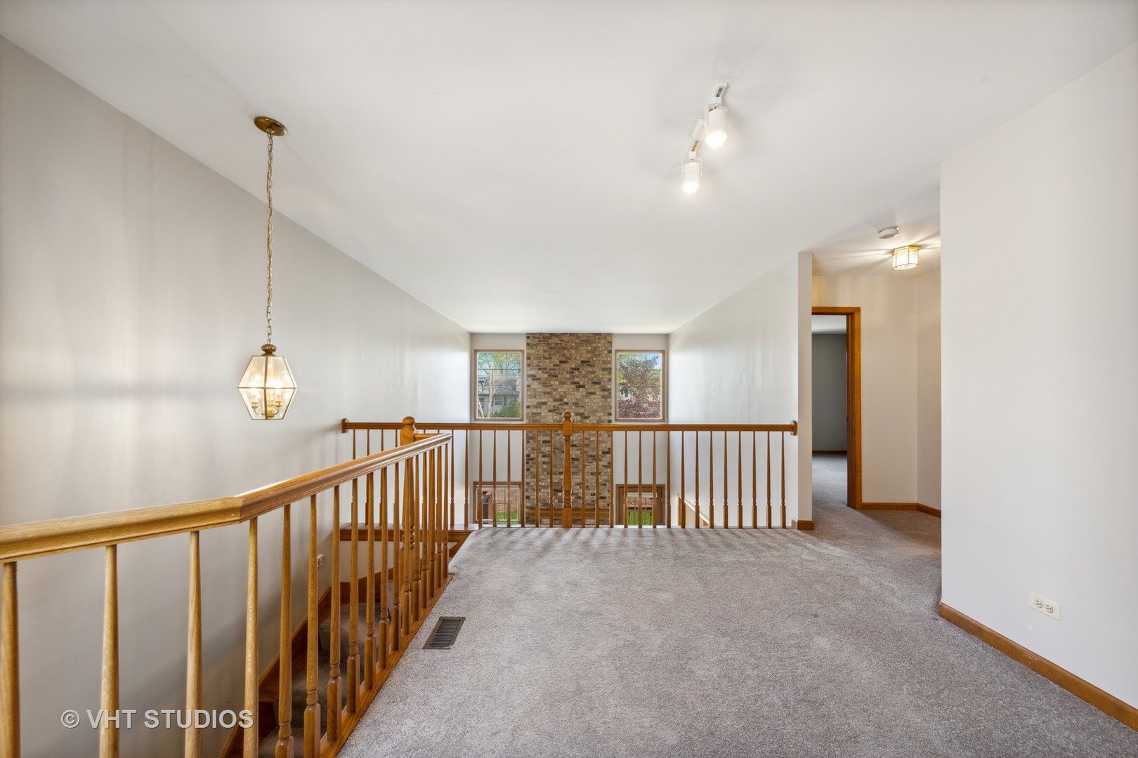 S023 Quail Run Court Winfield, IL 60190 - Photo 13 of 25 a view of staircase with railing and a chandelier