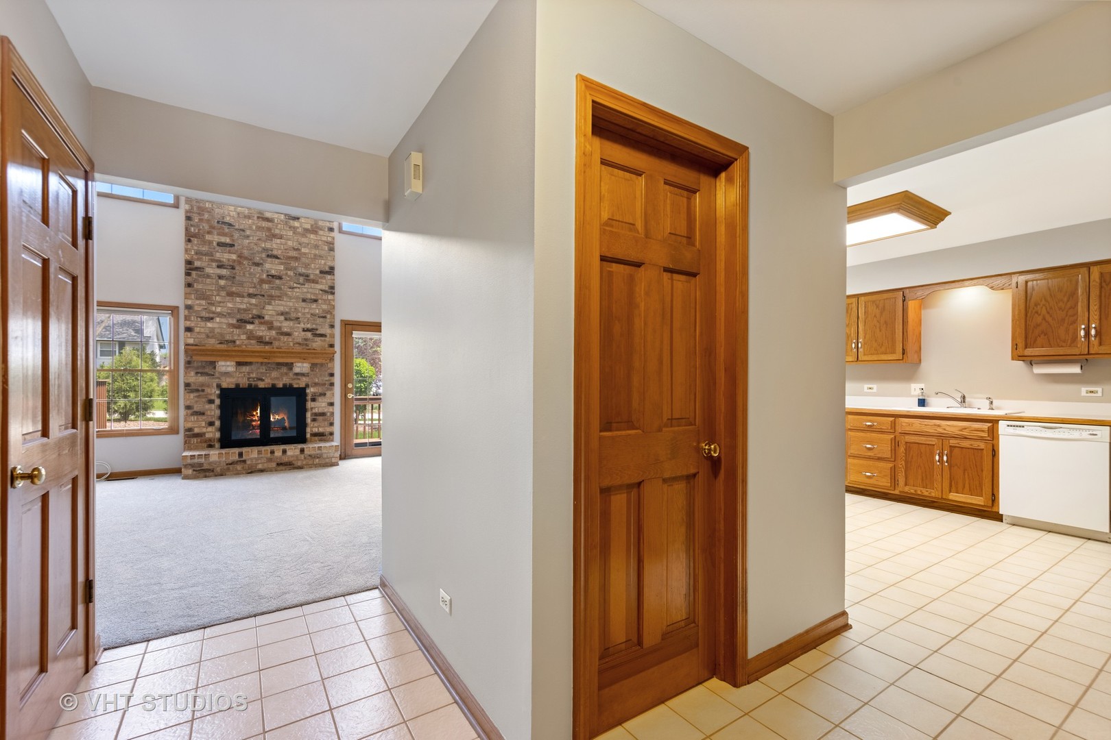 S023 Quail Run Court Winfield, IL 60190 - Photo 3 of 25 a view of a hallway view with furniture and a fireplace
