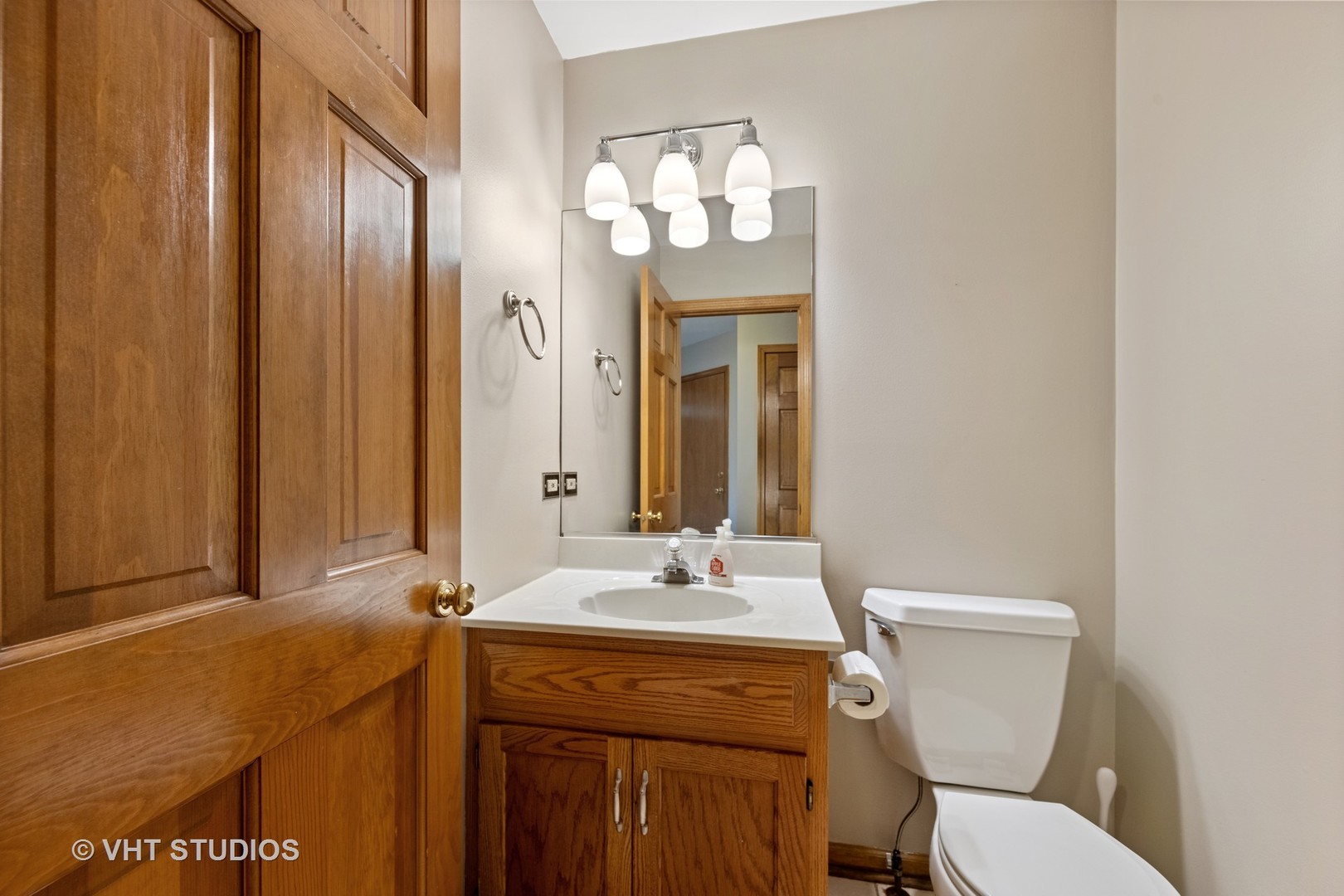 S023 Quail Run Court Winfield, IL 60190 - Photo 5 of 25 a bathroom with a granite countertop toilet sink and mirror