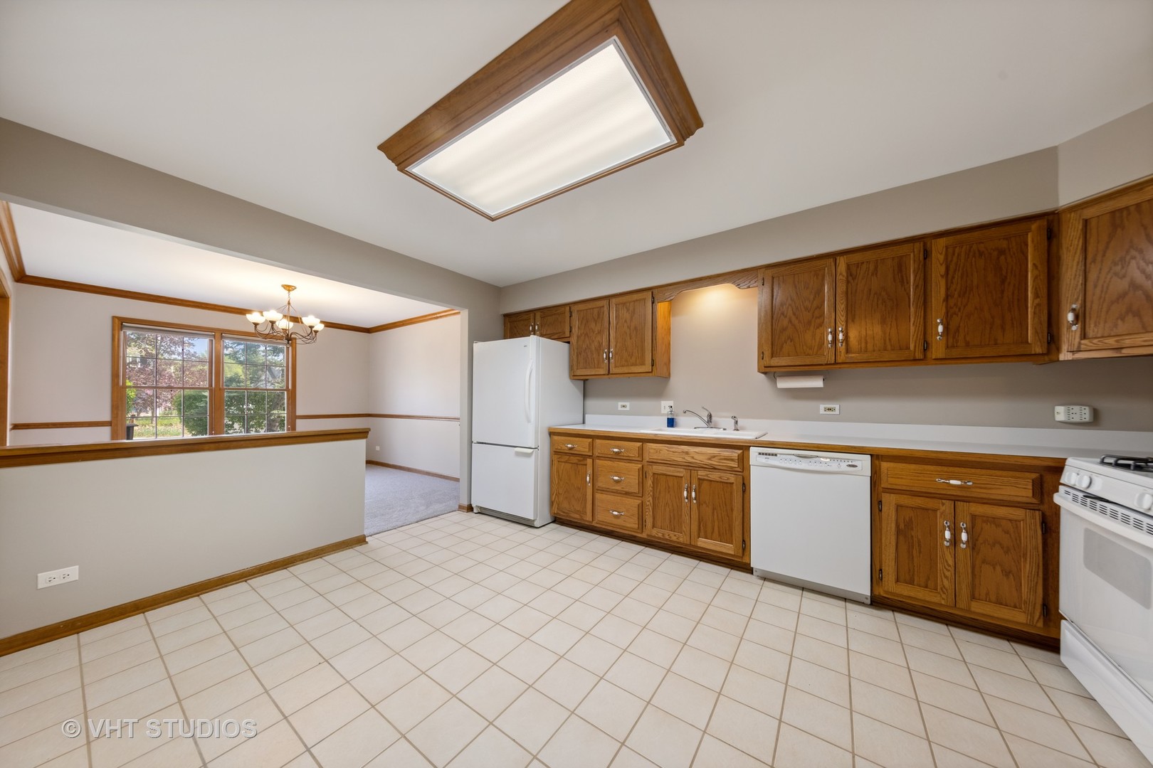 S023 Quail Run Court Winfield, IL 60190 - Photo 6 of 25 a large kitchen with cabinets and furniture