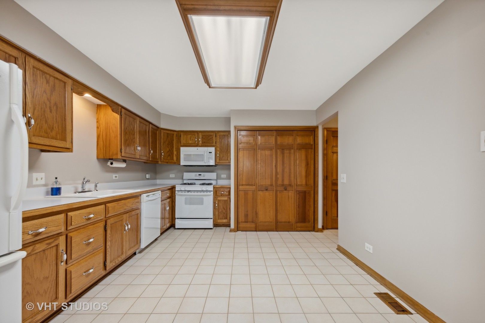 S023 Quail Run Court Winfield, IL 60190 - Photo 7 of 25 a kitchen with a refrigerator and a sink