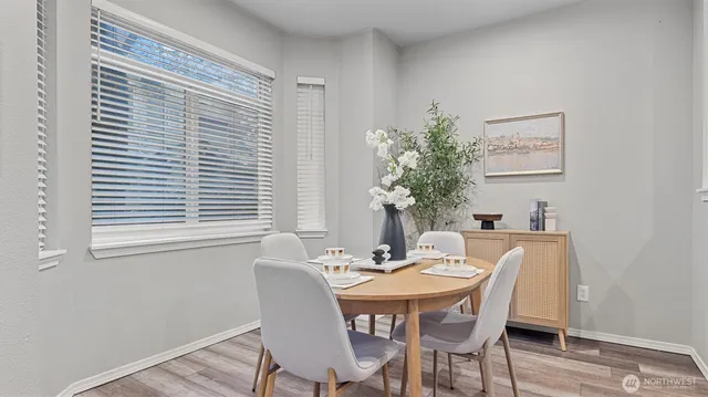 a dining room with furniture and window
