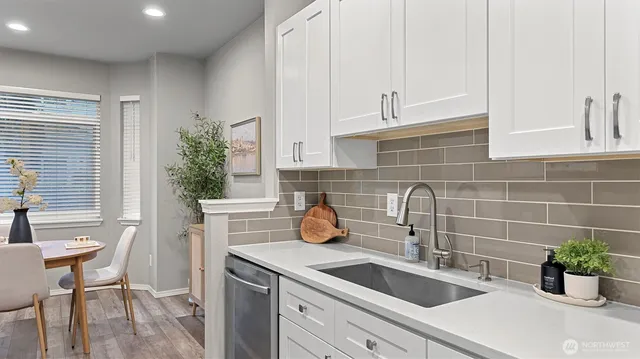 a kitchen with a sink and cabinets