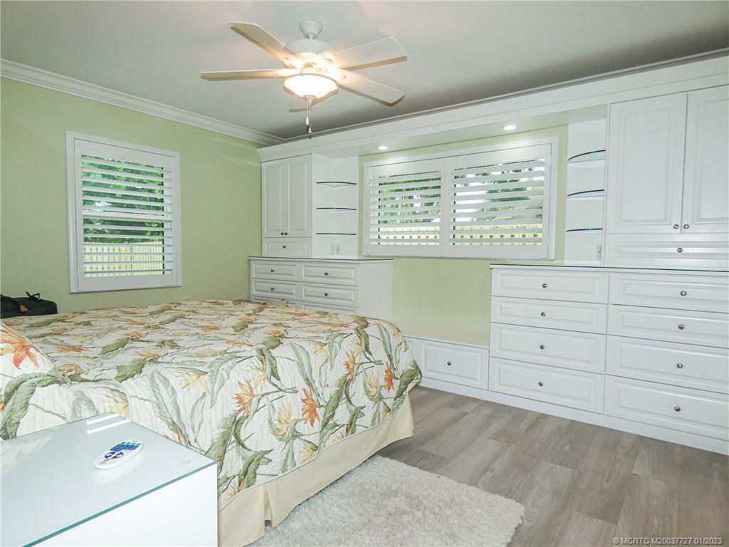 308 Southwest Ridge Lane Stuart, FL 34994 - Photo 18 of 43 a bedroom with a bed and a window