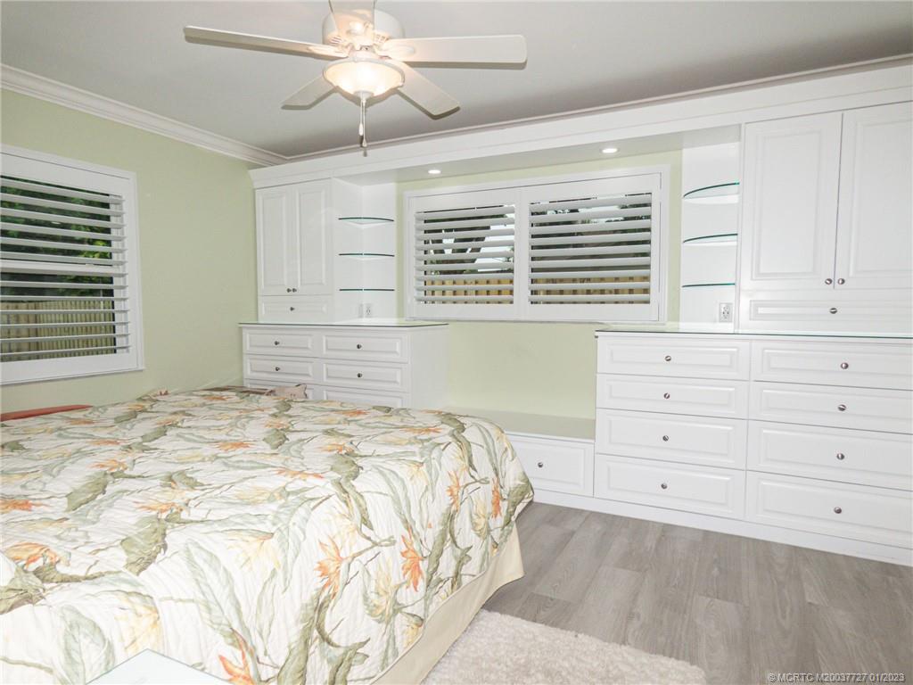 308 Southwest Ridge Lane Stuart, FL 34994 - Photo 19 of 43 a bedroom with a large bed and a window