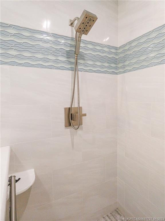 308 Southwest Ridge Lane Stuart, FL 34994 - Photo 24 of 43 a bathroom with a shower