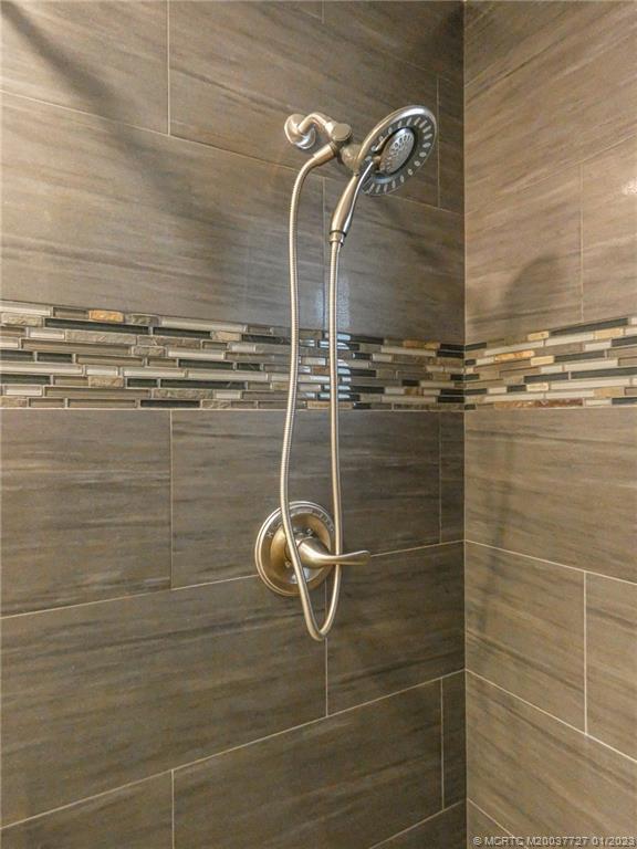 308 Southwest Ridge Lane Stuart, FL 34994 - Photo 29 of 43 a bathroom with a shower