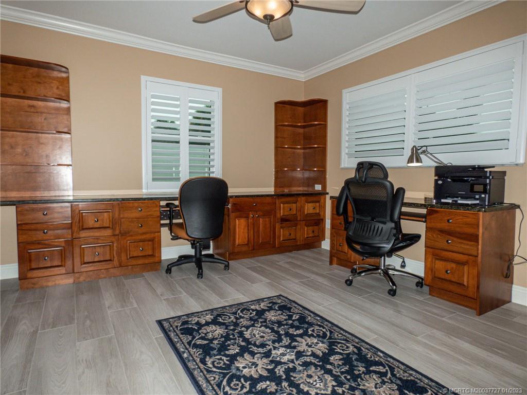 308 Southwest Ridge Lane Stuart, FL 34994 - Photo 30 of 43 a view of a workspace with furniture and a window