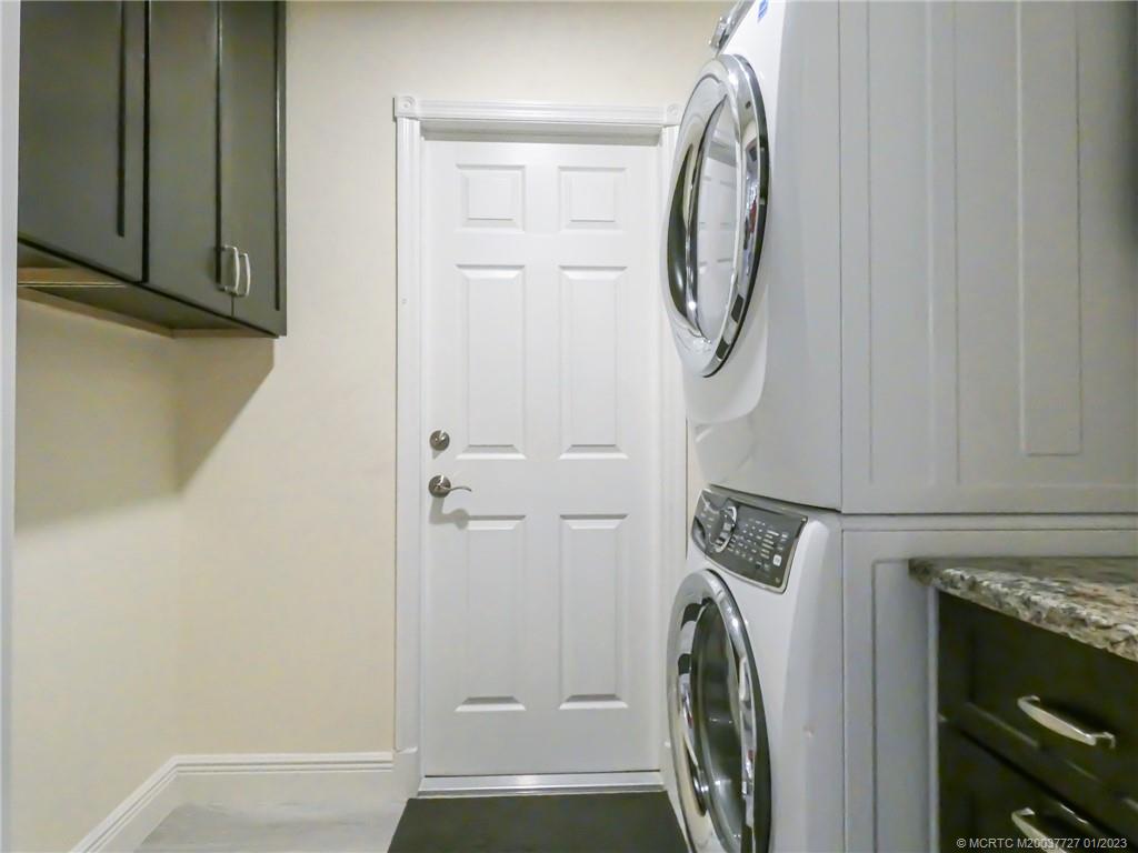308 Southwest Ridge Lane Stuart, FL 34994 - Photo 32 of 43 a view of a storage and utility room with a washer and dryer