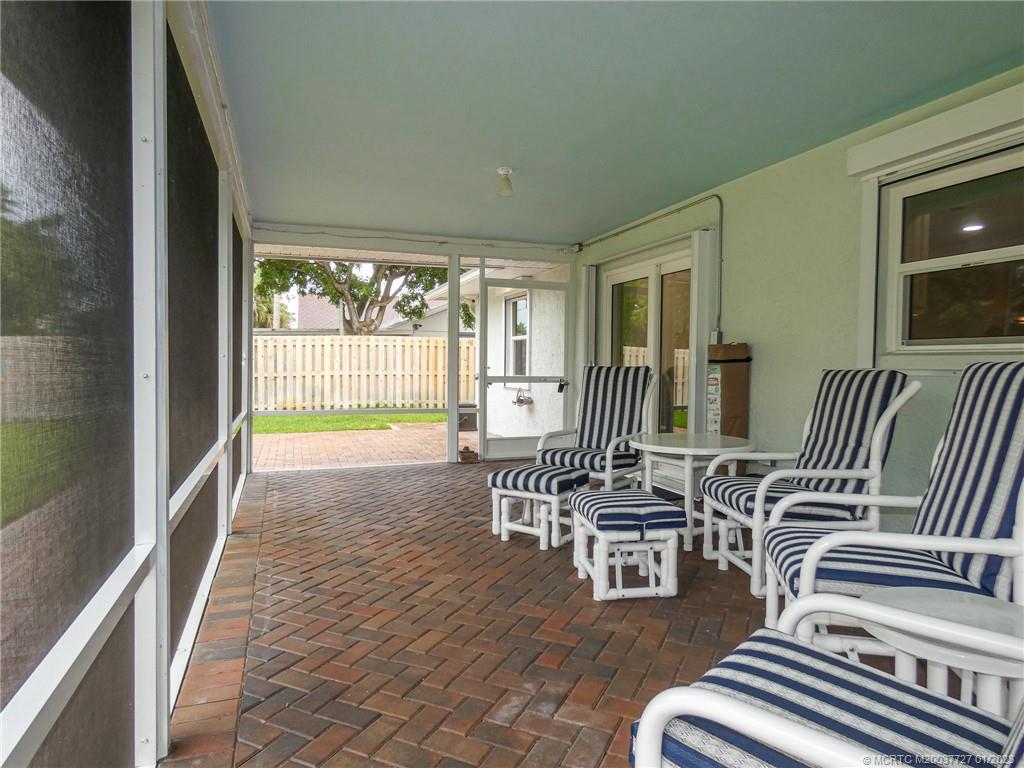 308 Southwest Ridge Lane Stuart, FL 34994 - Photo 34 of 43 a living room with furniture and a large window