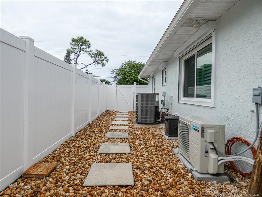 308 Southwest Ridge Lane Stuart, FL 34994 - Photo 37 of 43 a view of a backyard with sitting area
