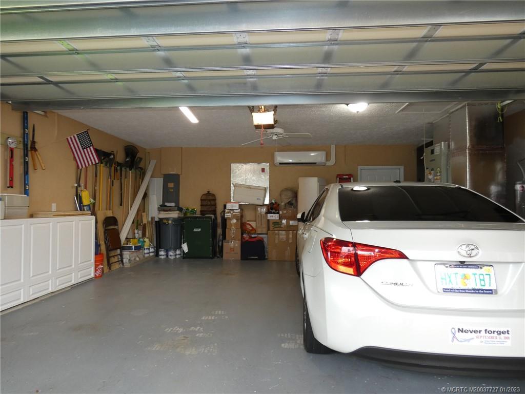 308 Southwest Ridge Lane Stuart, FL 34994 - Photo 38 of 43 a utility room with dryer and bicycles