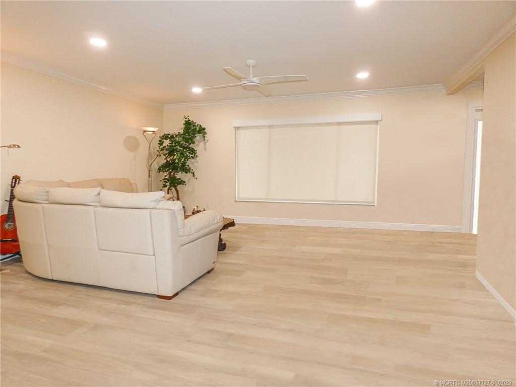 308 Southwest Ridge Lane Stuart, FL 34994 - Photo 5 of 43 a bathroom with a sink a mirror and a potted plant