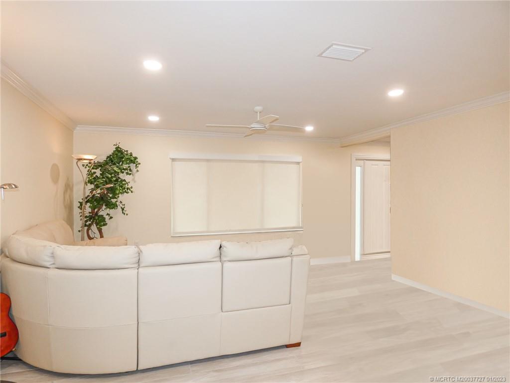 308 Southwest Ridge Lane Stuart, FL 34994 - Photo 6 of 43 a living room with furniture and flowers