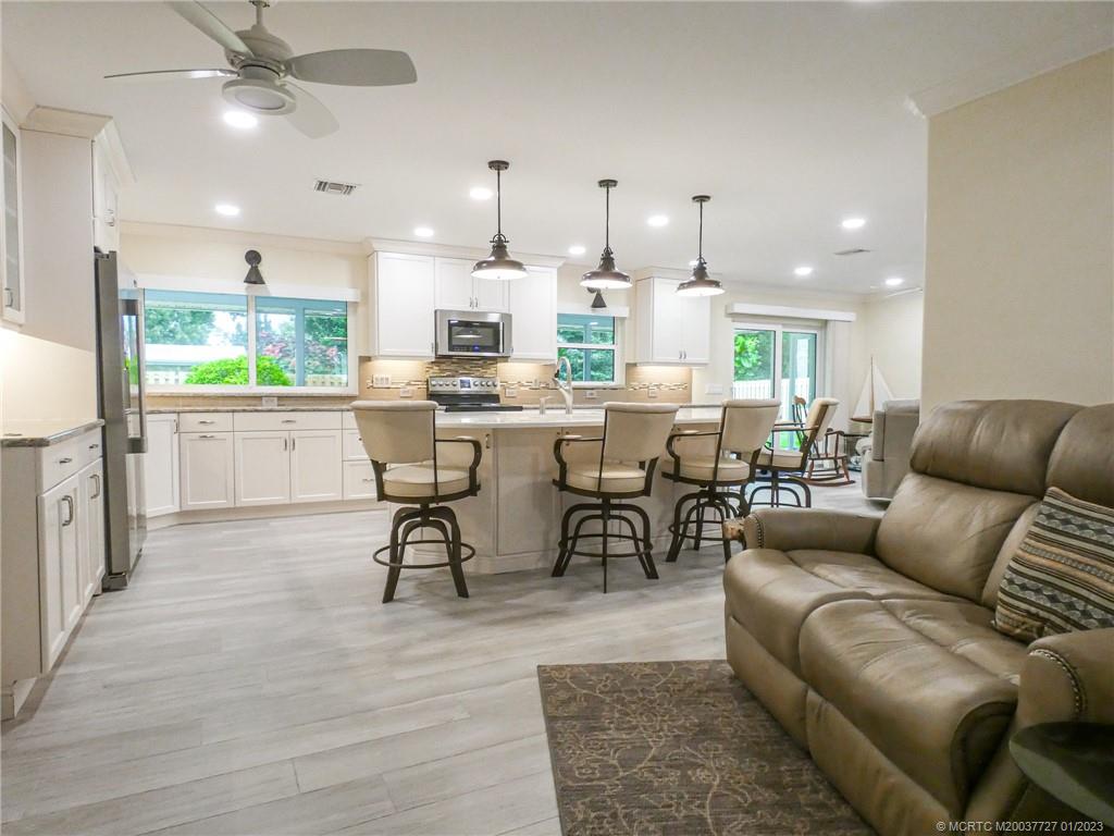 308 Southwest Ridge Lane Stuart, FL 34994 - Photo 8 of 43 a view of a dining room with furniture