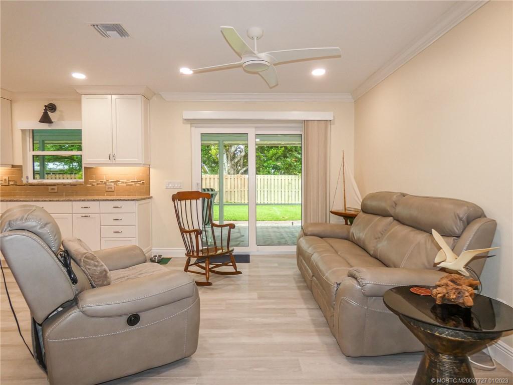 308 Southwest Ridge Lane Stuart, FL 34994 - Photo 9 of 43 a living room with furniture and a large window