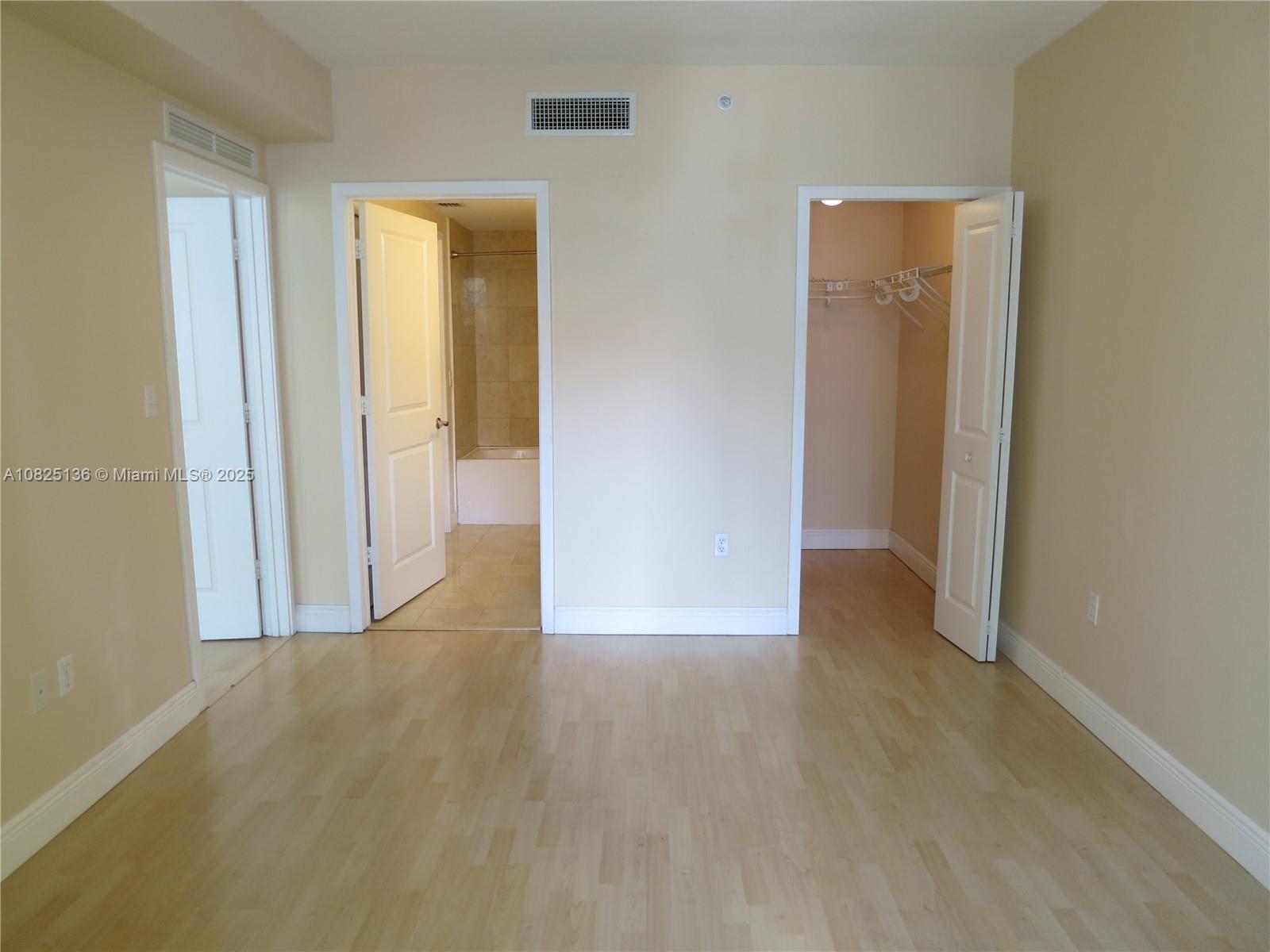 170 Southeast 14th Street, Unit 1407 Miami, FL 33131 - Photo 24 of 25 an empty room with closet and a bathroom