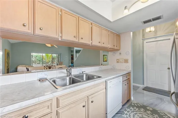 a kitchen with a sink and cabinets