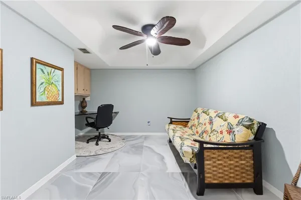 a bed room with a bed and a chair