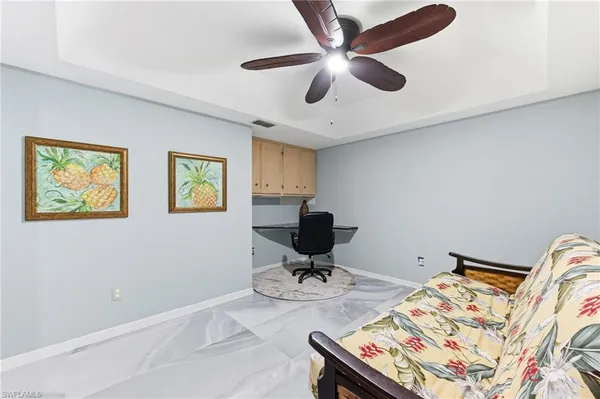 a view of a workspace with furniture