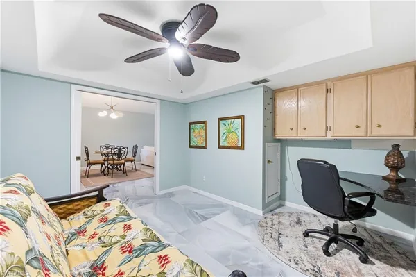 a bedroom with a workspace