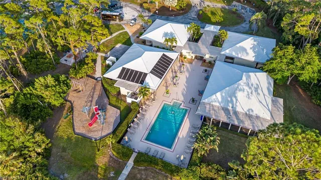 an aerial view of a house with a garden and outdoor space
