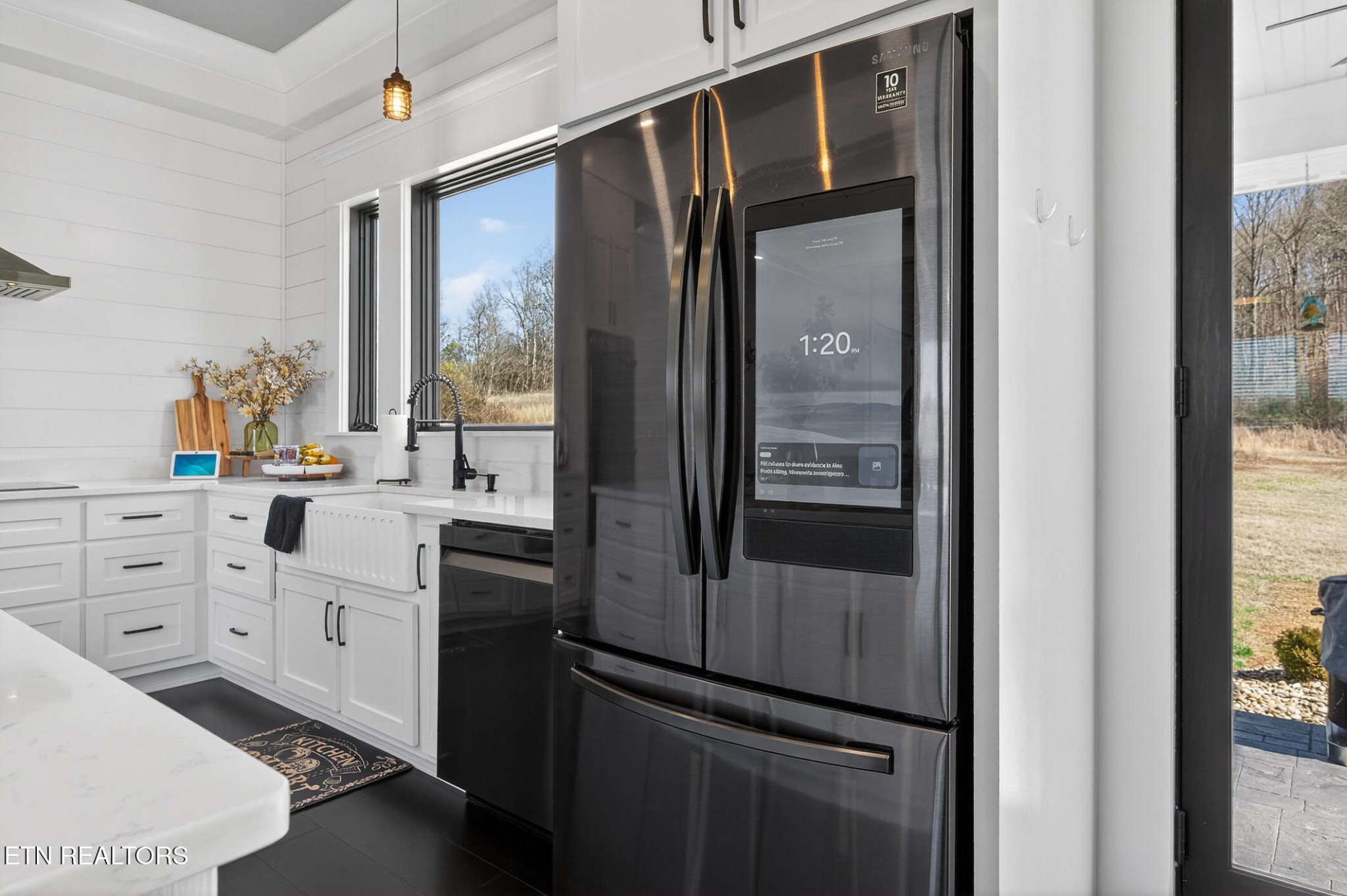 6161 Hiawatha Road Morristown, TN 37814 - Photo 19 of 48 a kitchen with white cabinets and a refrigerator