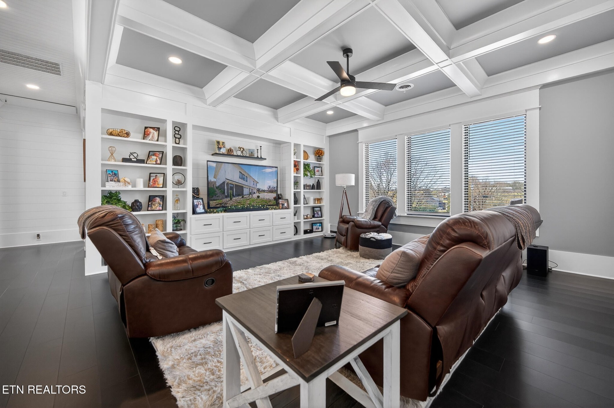 6161 Hiawatha Road Morristown, TN 37814 - Photo 25 of 48 a living room with furniture a flat screen tv and a ceiling fan