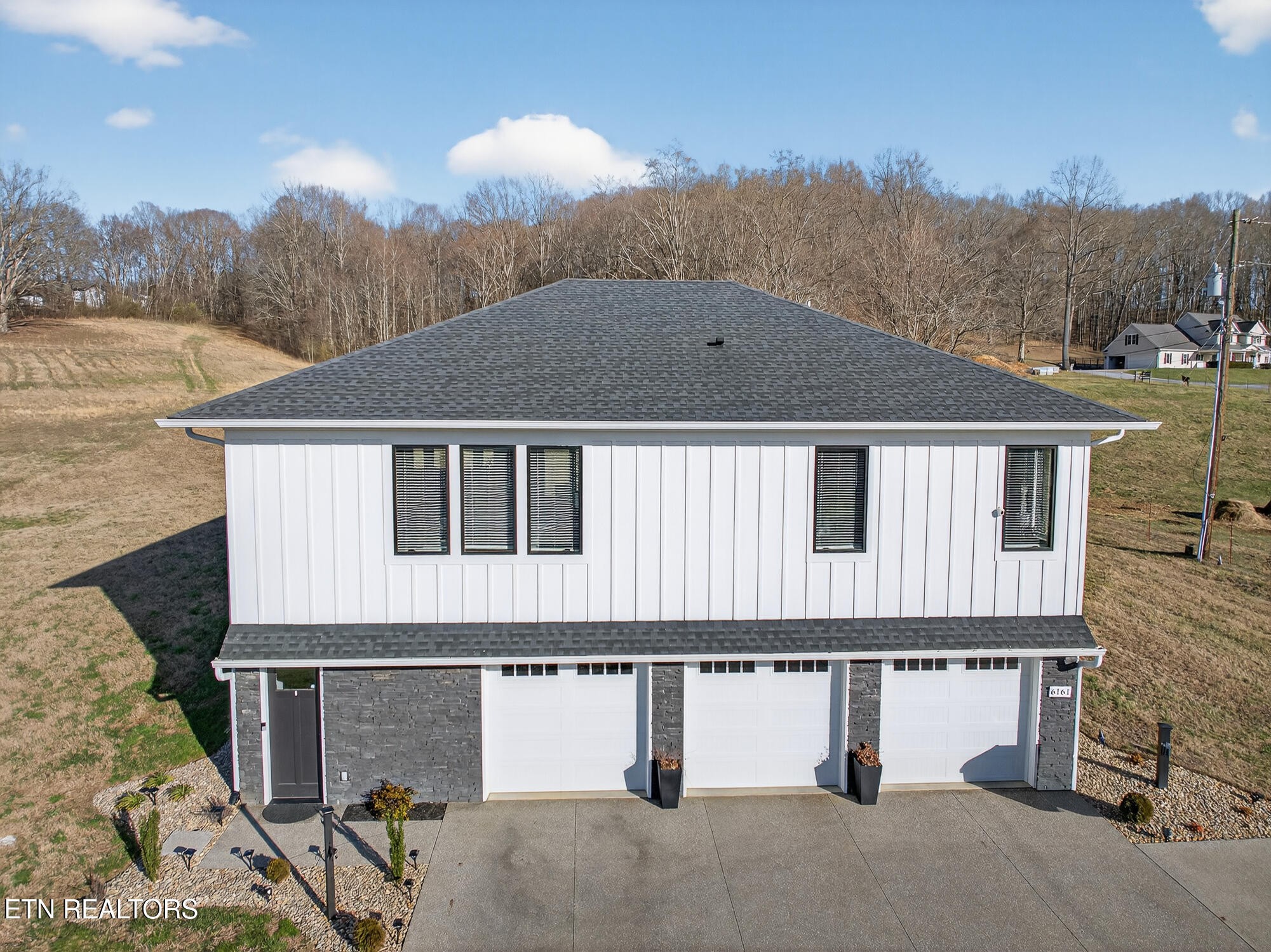 6161 Hiawatha Road Morristown, TN 37814 - Photo 5 of 48 a front view of a house with a yard and garage