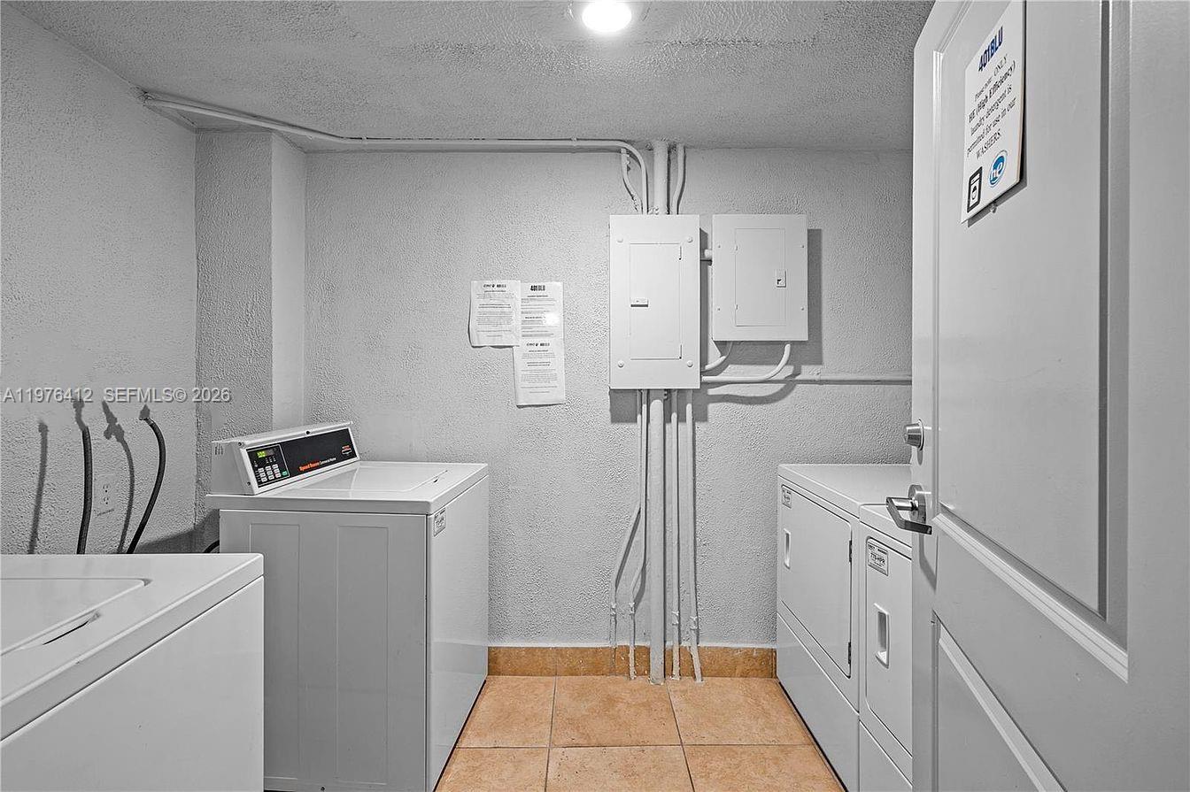 401 69th Street, Unit 405 Miami Beach, FL 33141 - Photo 13 of 20 a view of a room with washer and dryer